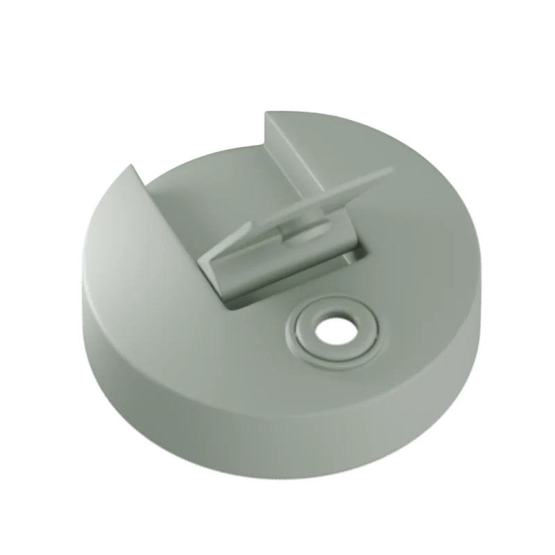 Sage green plastic component on a white background