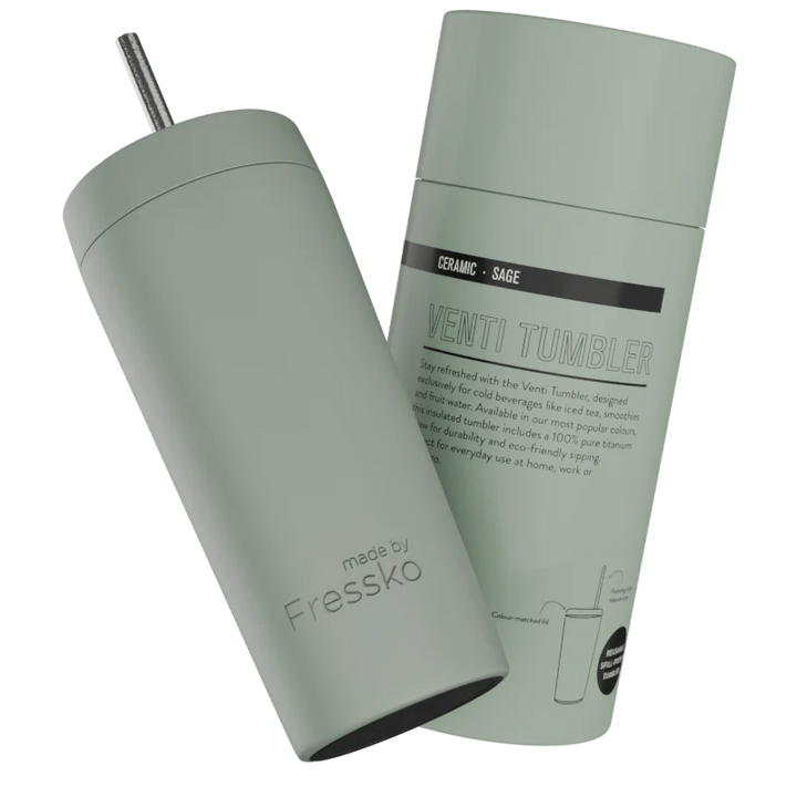 Sage green tumbler with straw and packaging on a white background