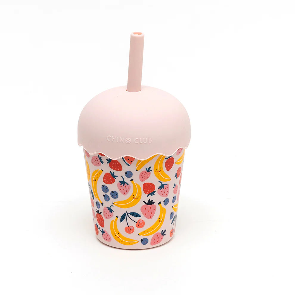 Reusable cup with fruit pattern and pink lid on a white background