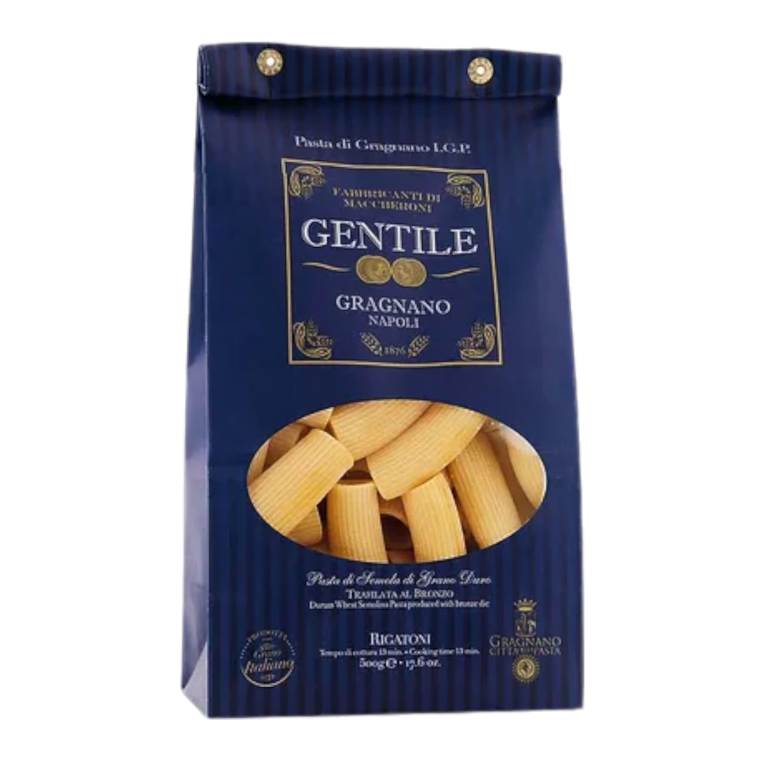 A bag of Gentile dried rigatoni pasta on a white background