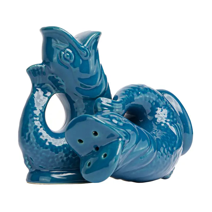 Blue ceramic salt and pepper shakers in the shape of a fish on a white background
