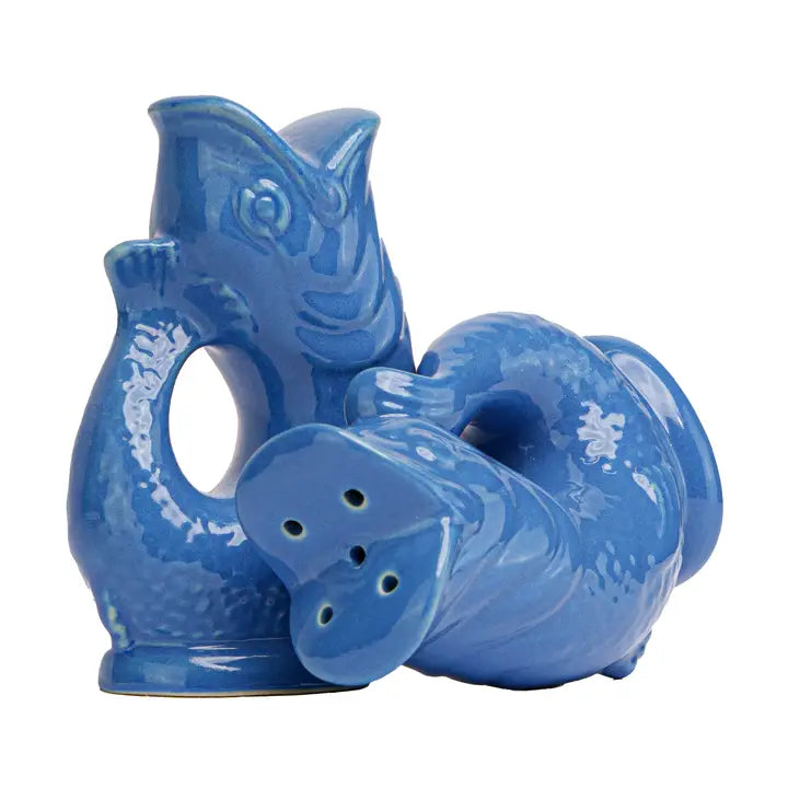 Blue ceramic salt and pepper shakers with fish design on a white background