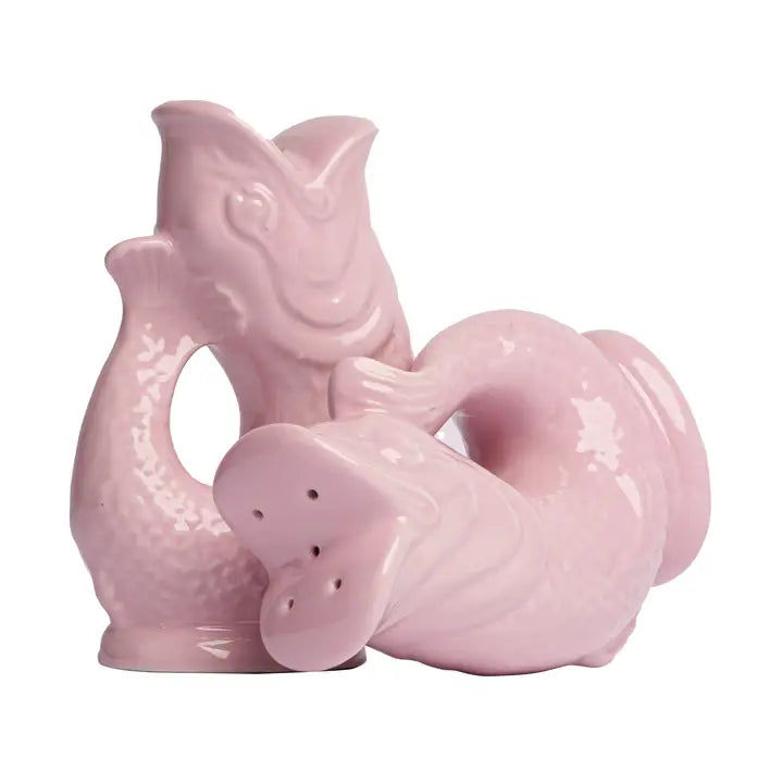 Pink ceramic fish-shaped salt and pepper shaker set on a white background
