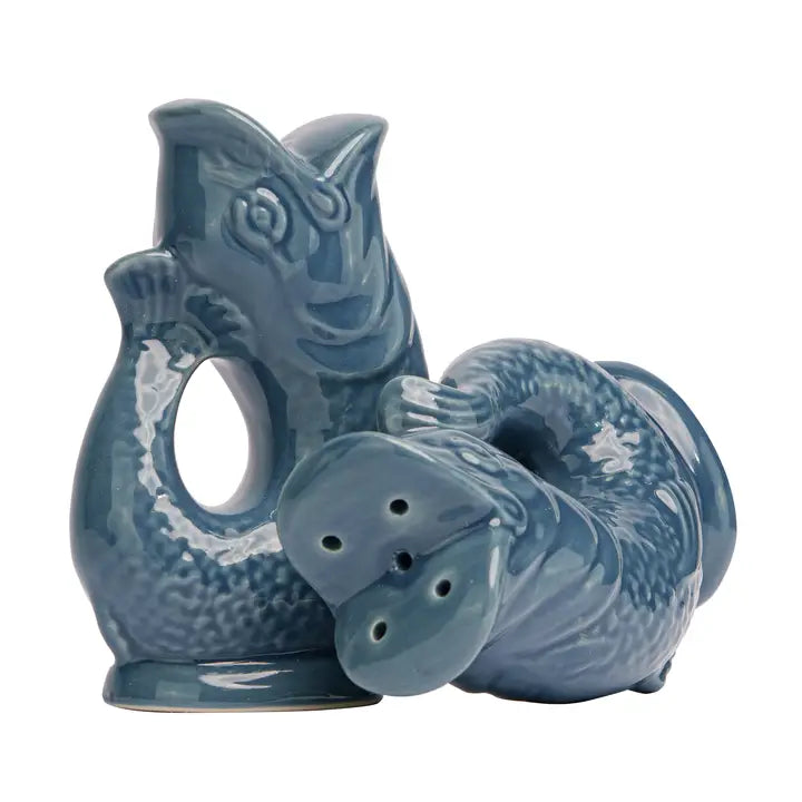 Blue ceramic fish-shaped salt and pepper shakers on a white background