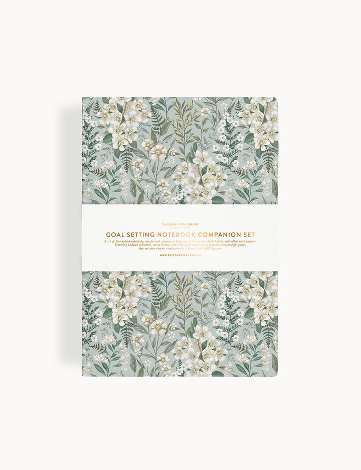 Floral design notebook set on a white background