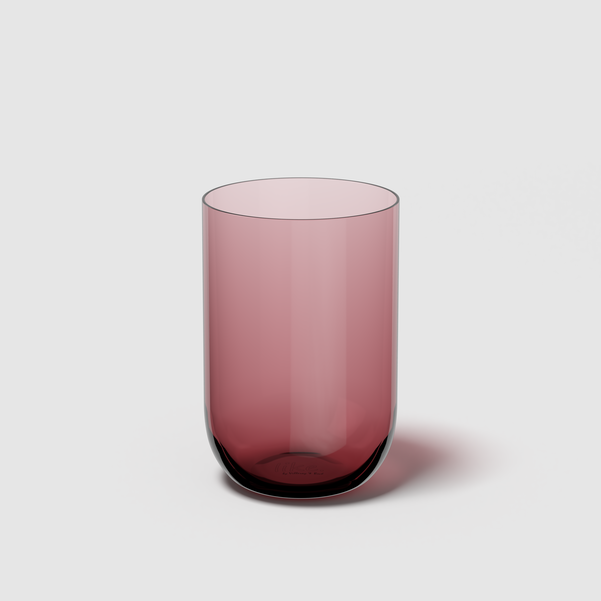 Pink glass tumbler on a light gray background