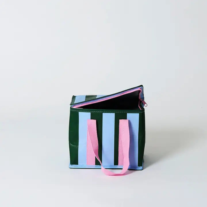 Striped bag with pink handles on a light gray background