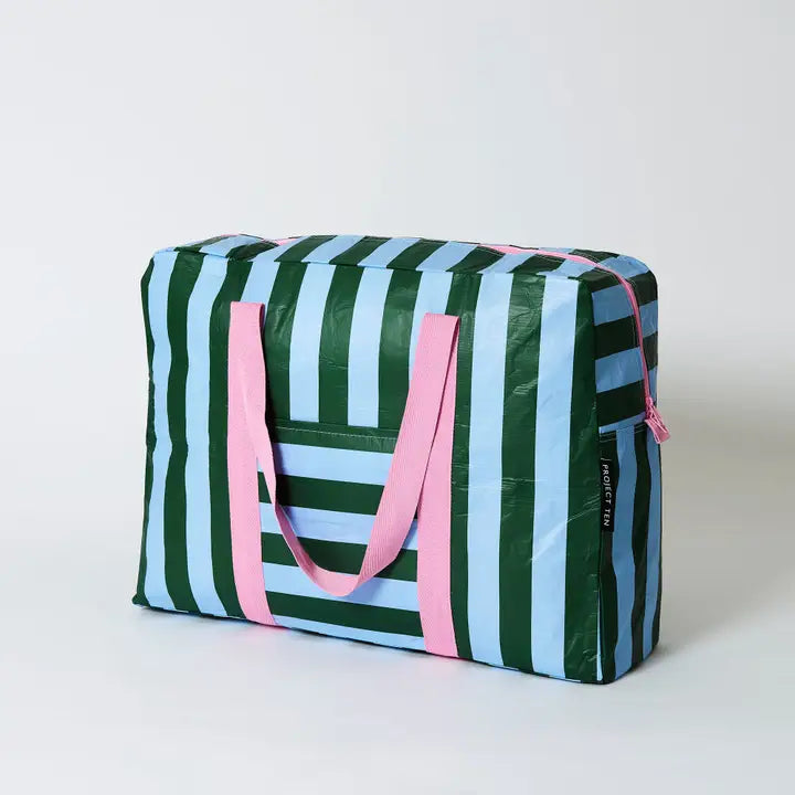 Striped bag with green, blue, and pink colors on a white background