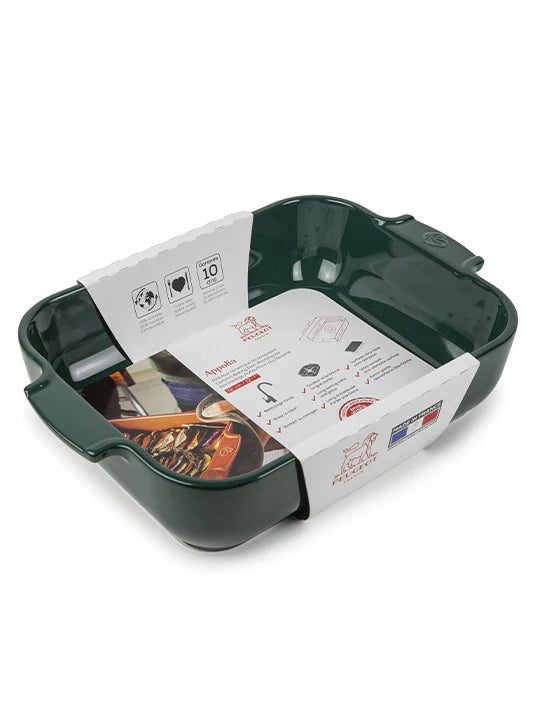 Green ceramic baking dish with printed instructions on a white background