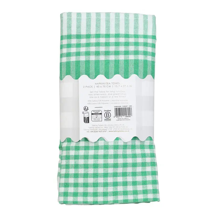 Green and white checkered towel packaging on a white background