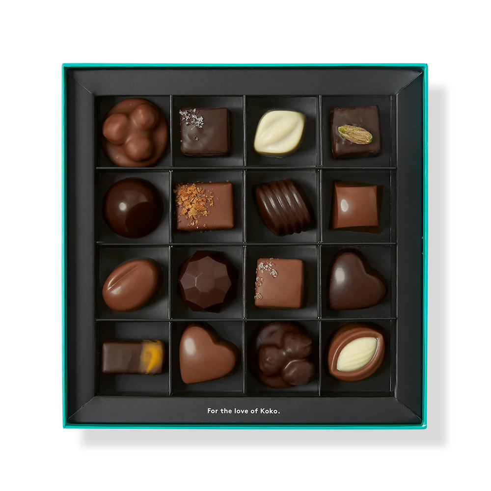 Assorted chocolates in a black box with a white background