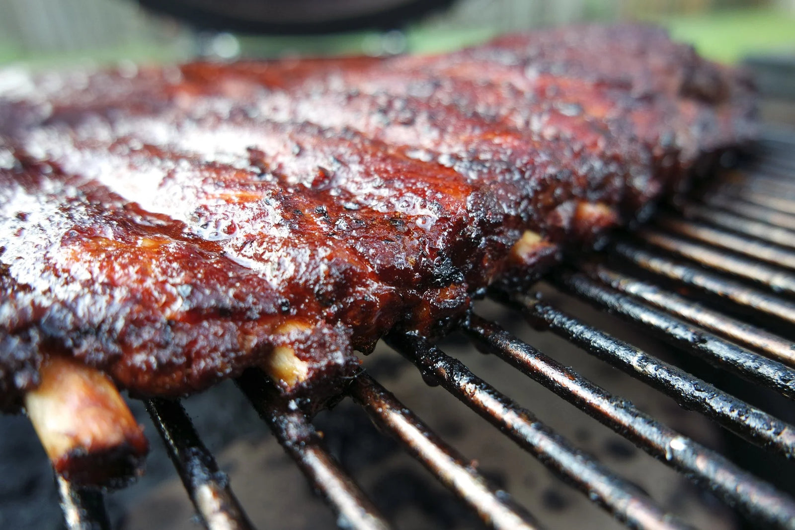 Marinated pork ribs cooking on a grill 