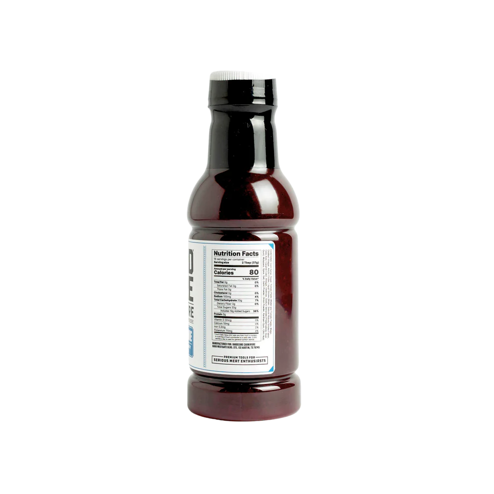 Bottle of sauce with a label on a white background