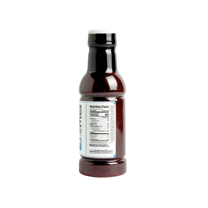 Bottle of sauce with a label on a white background
