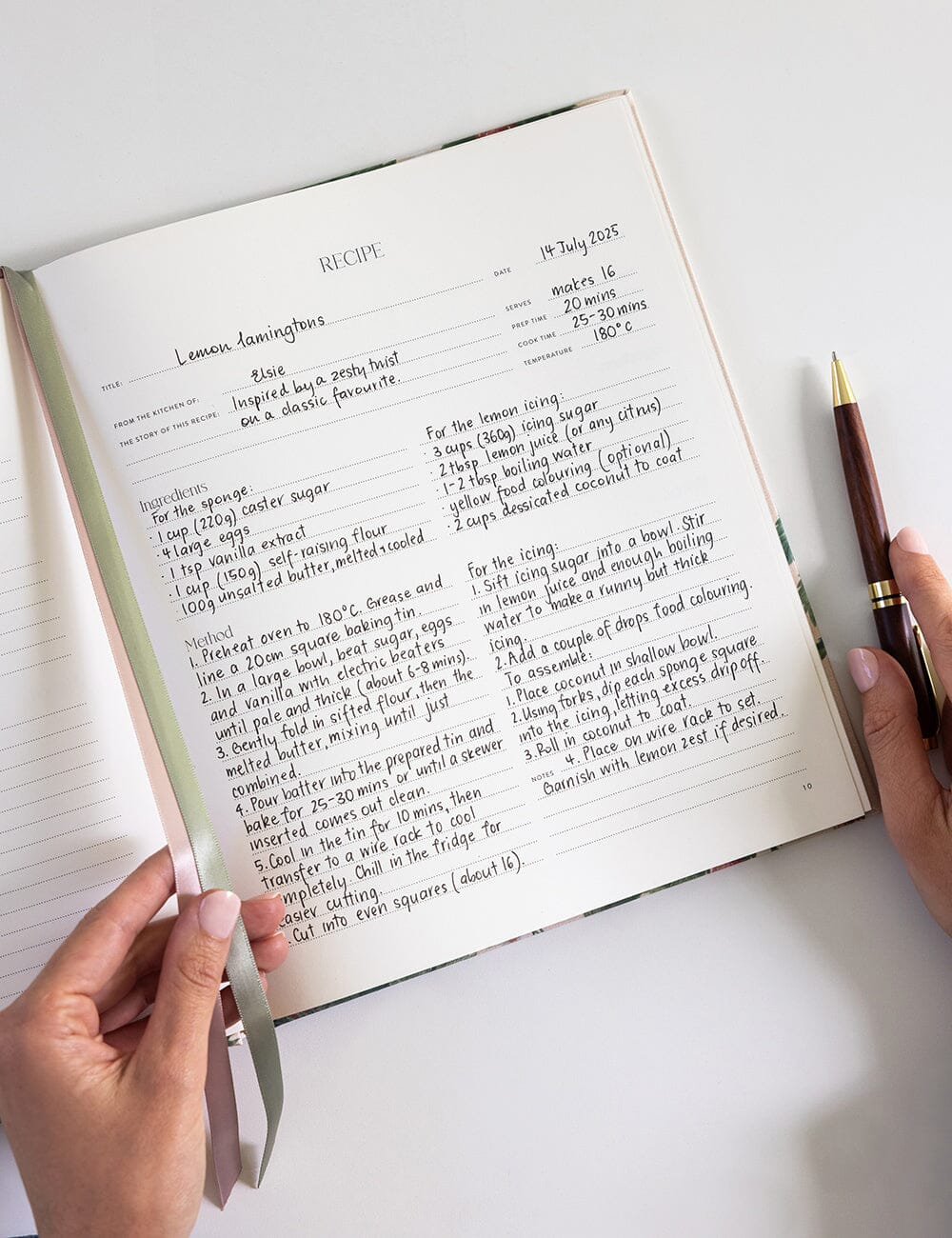 Handwritten recipe in a notebook with a pen on a white surface