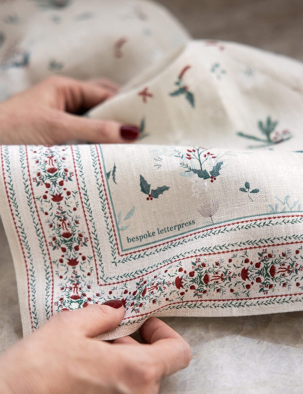 A close up of a christmas linen tea towel