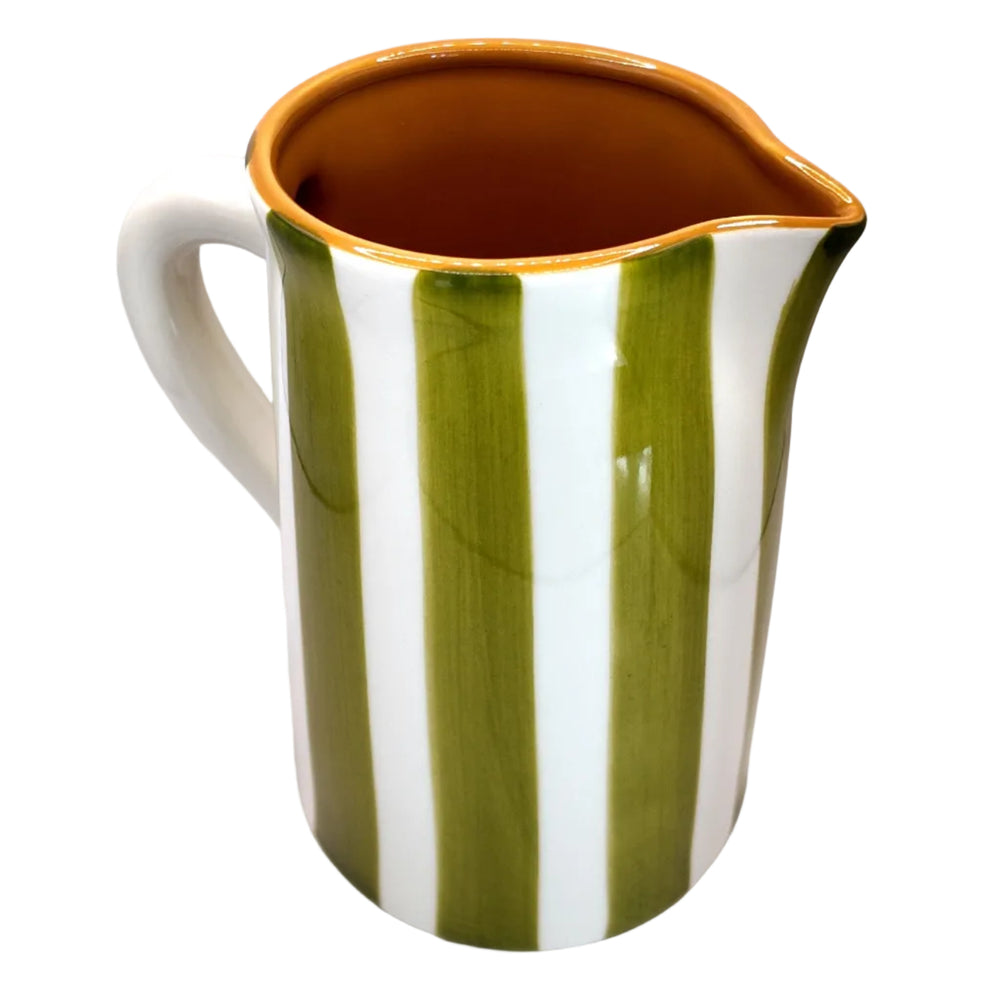Ceramic pitcher with green and white stripes on a white background
