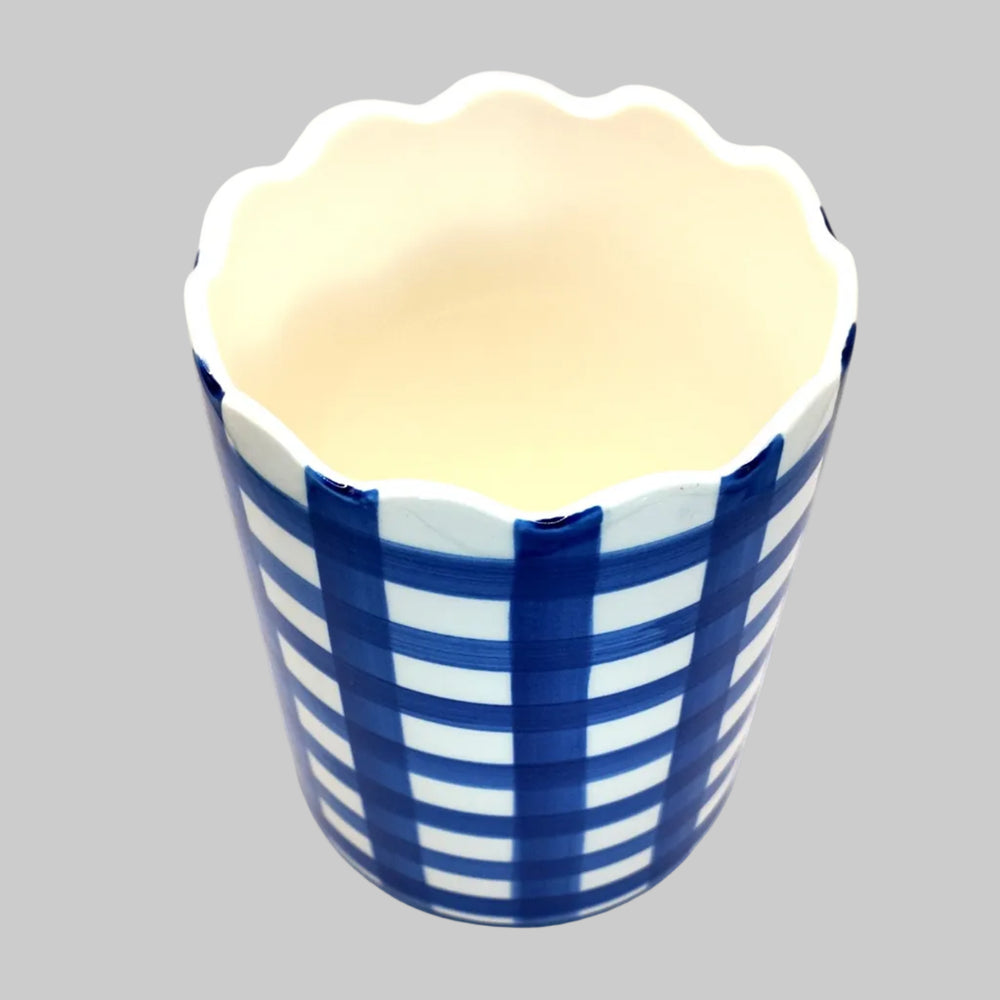 Ceramic wine cooler with blue and white striped design on a white background