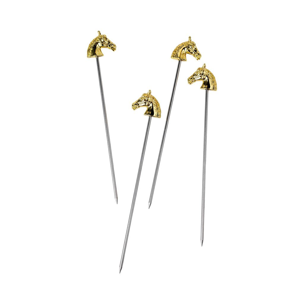 Four gold and silver food picks with horse head designs on a white background