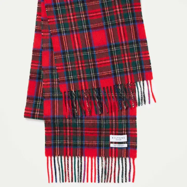 Red and green plaid scarf with fringes on a white background