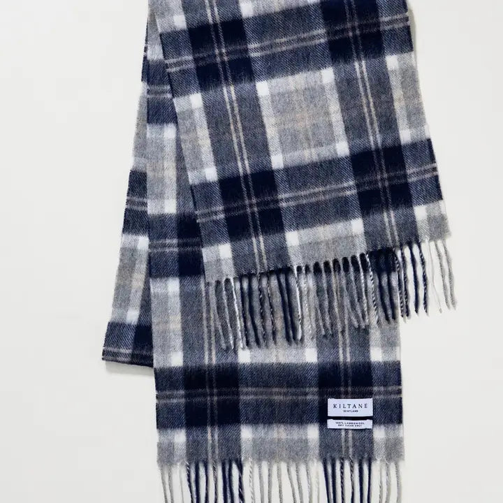 Plaid scarf with fringes on a white background