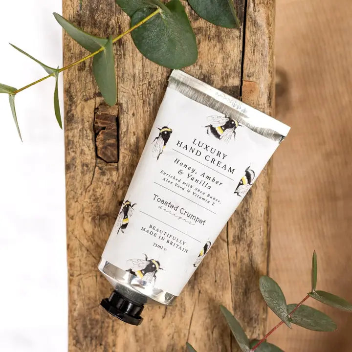 Hand cream tube labeled &