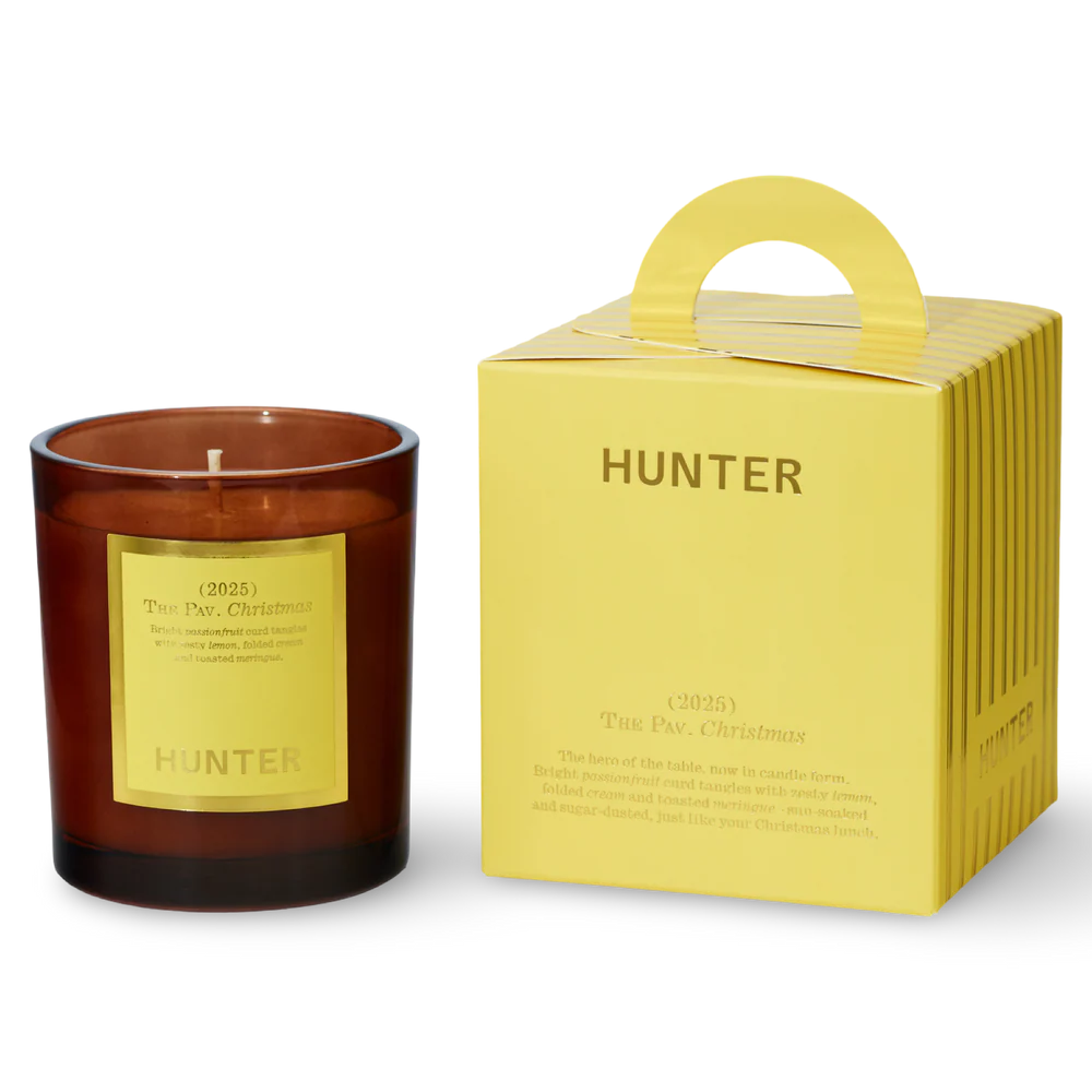 Hunter candle with a matching yellow box on a white background