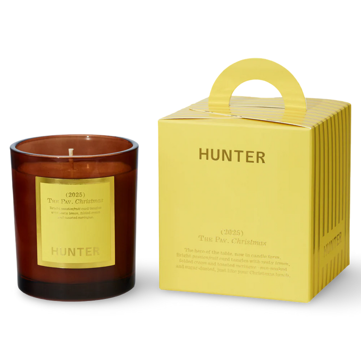 Hunter candle with a matching yellow box on a white background