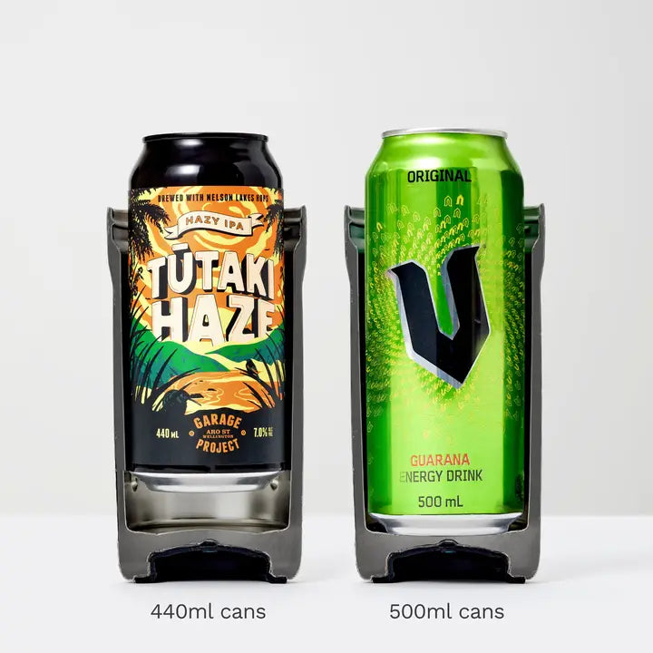 Two cans of different drinks in a can holder on a white background
