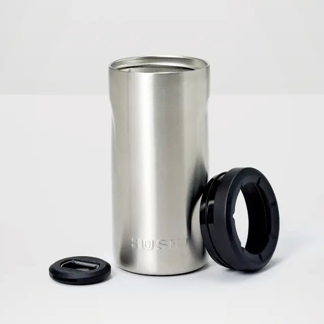 Stainless steel tumbler with black lid on a white background