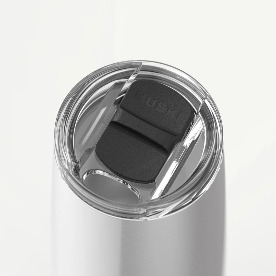 Close-up of a Huski tumbler lid on a white background