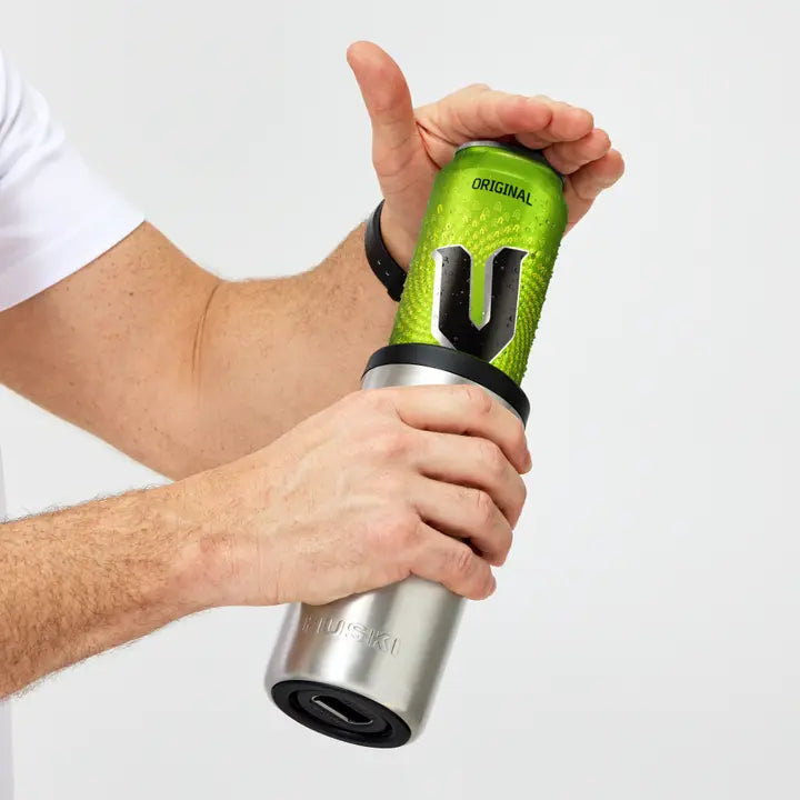 Person holding a green and silver grip trainer with 'Original' branding on a white background