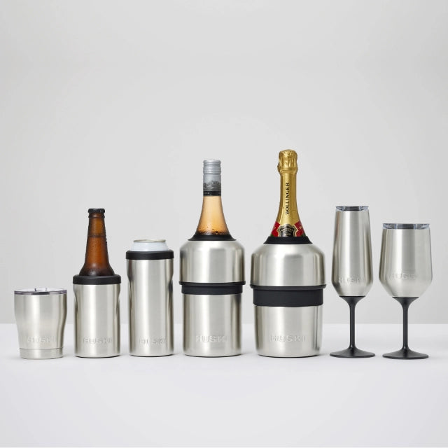Set of stainless steel bottle coolers and wine glasses on a white background