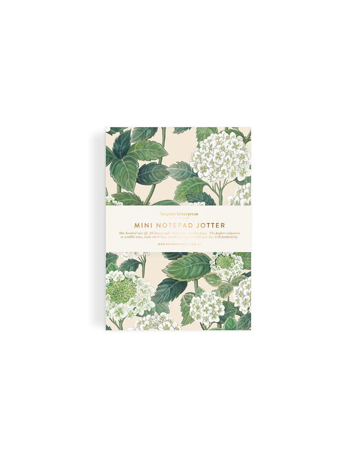 Mini notebook with floral design on a white background