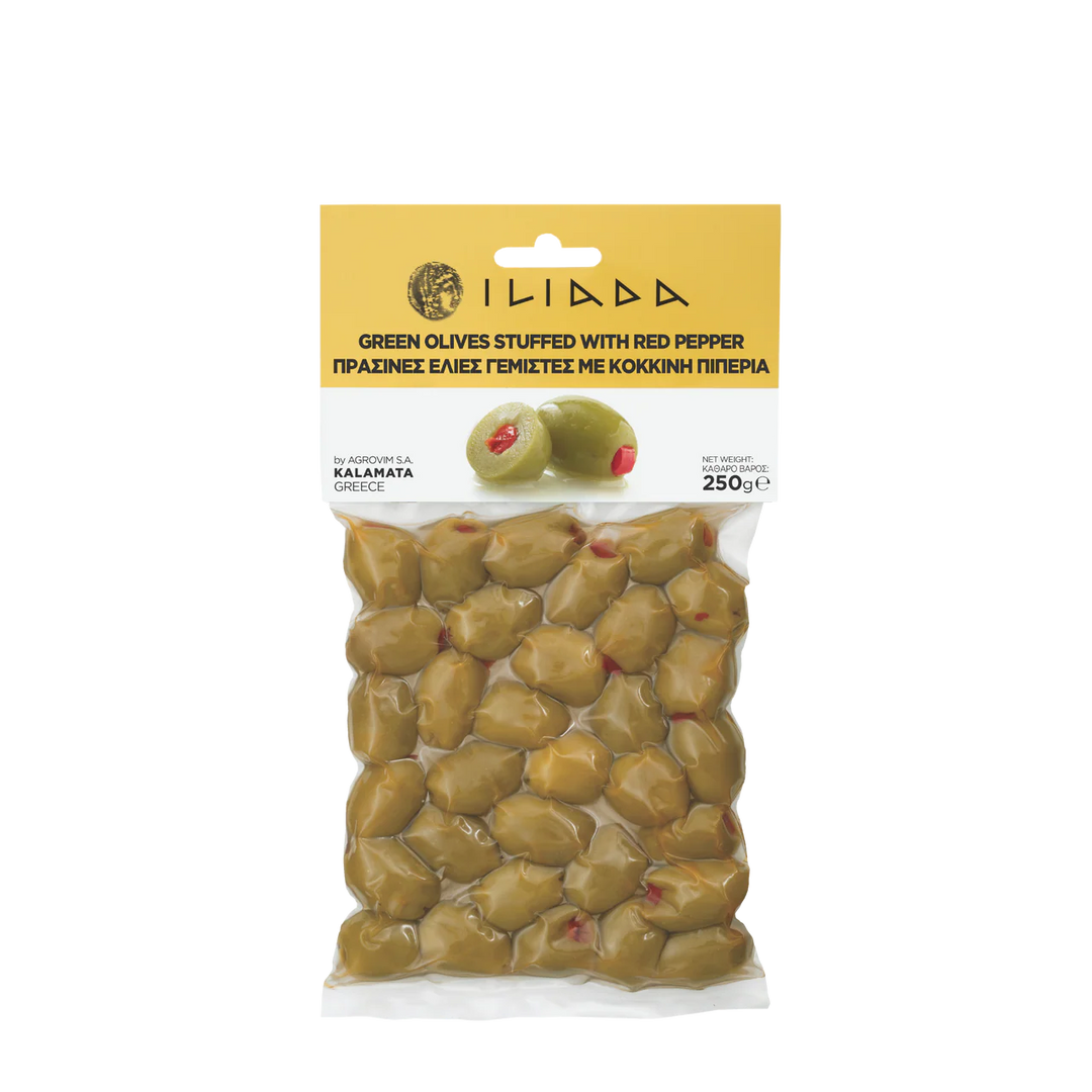 Packaged green olives stuffed with red pepper on a white background