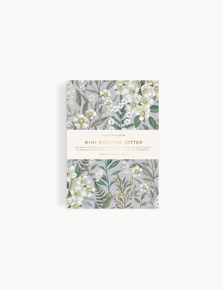 Pack of mini notebook jotter with floral design on a white background