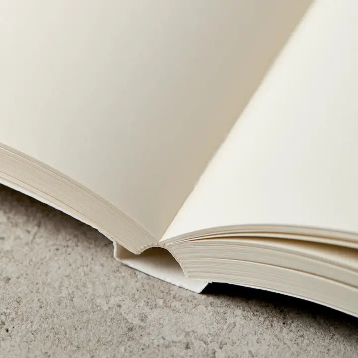 Open book on a textured surface