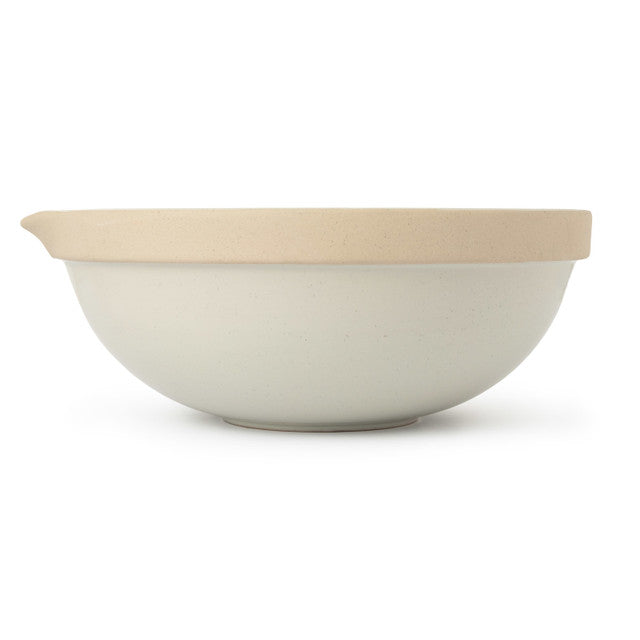 White bowl with beige interior on a white background