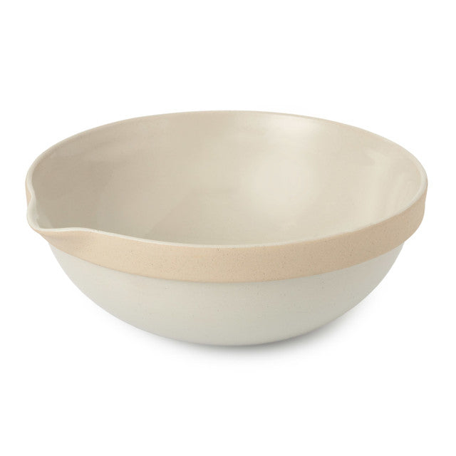 Beige and white ceramic bowl on a white background