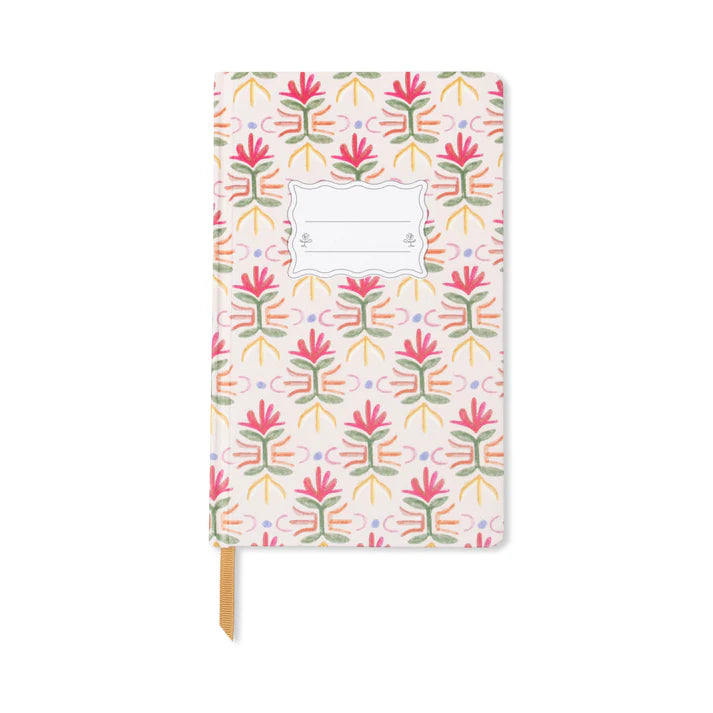A designworks journal with a colourful floral cover on a white background