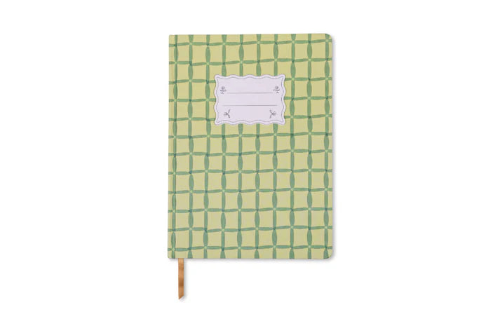 Green checkered notebook with a white label on a white background