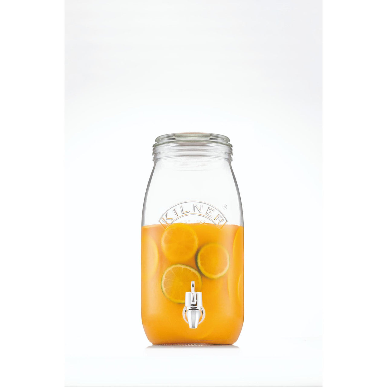 Clear glass drink dispenser filled with orange juice on a white background