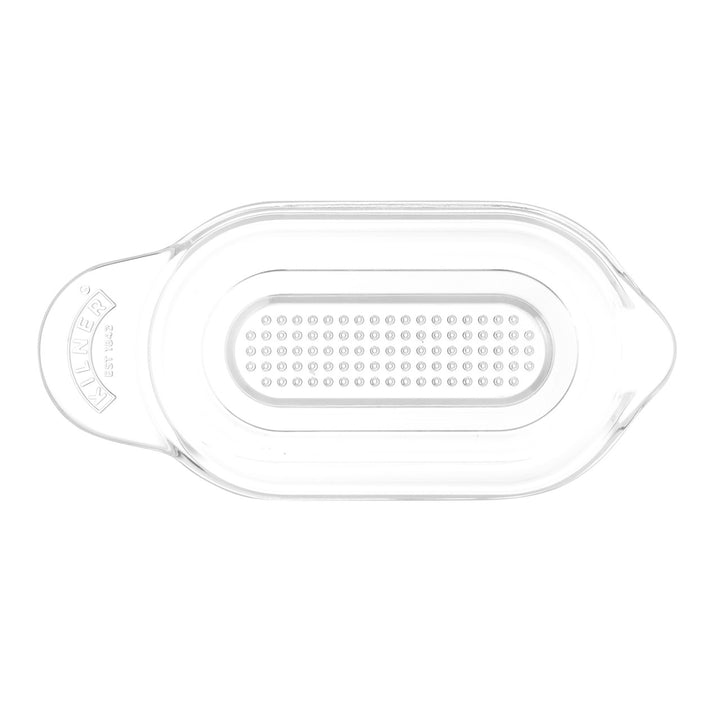 Clear plastic lid with a textured surface on a white background