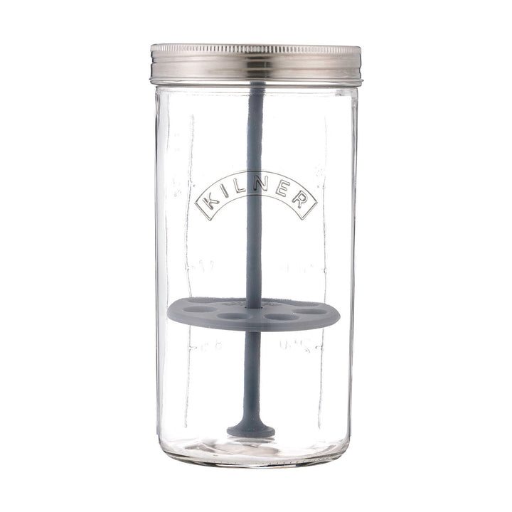 Clear glass jar with a metal lid and gray silicone components on a white background