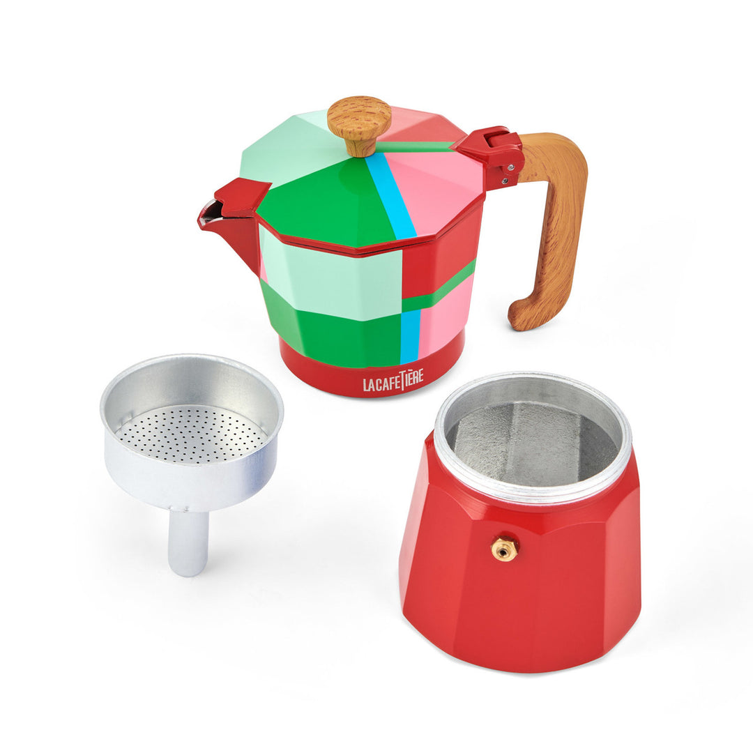 Colorful geometric-patterned coffee pot with wooden handle and metal parts on a white background