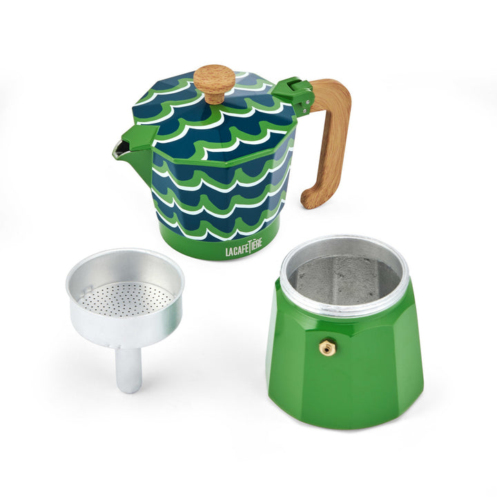 Green and blue wave-patterned coffee maker with wooden handle on a white background