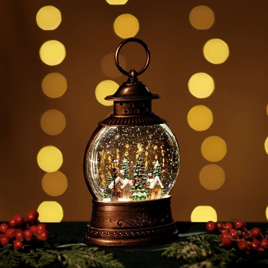 Decorative lantern snow globe with Christmas scene against a warm background