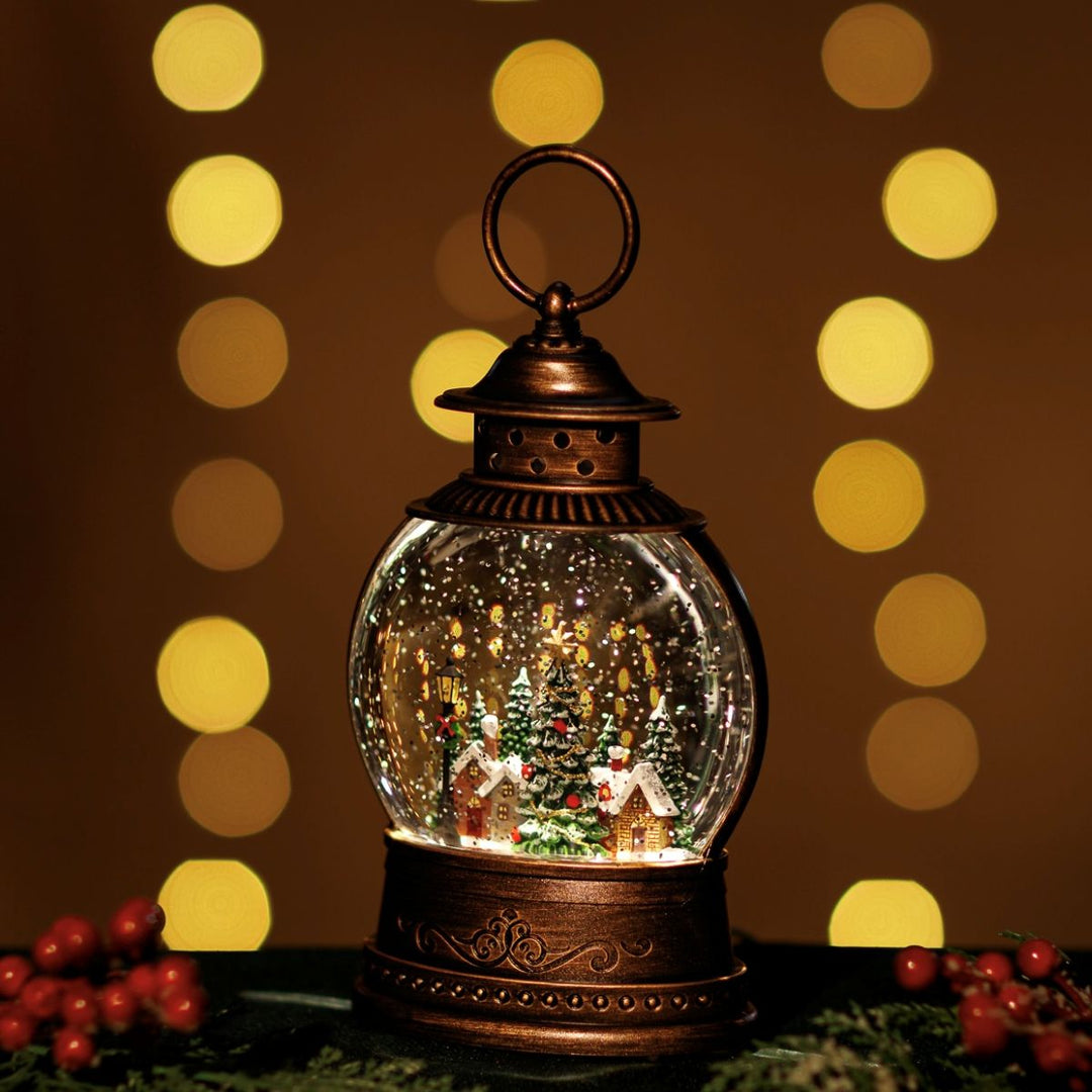 Decorative lantern with a snow globe inside, surrounded by blurred lights on a dark background