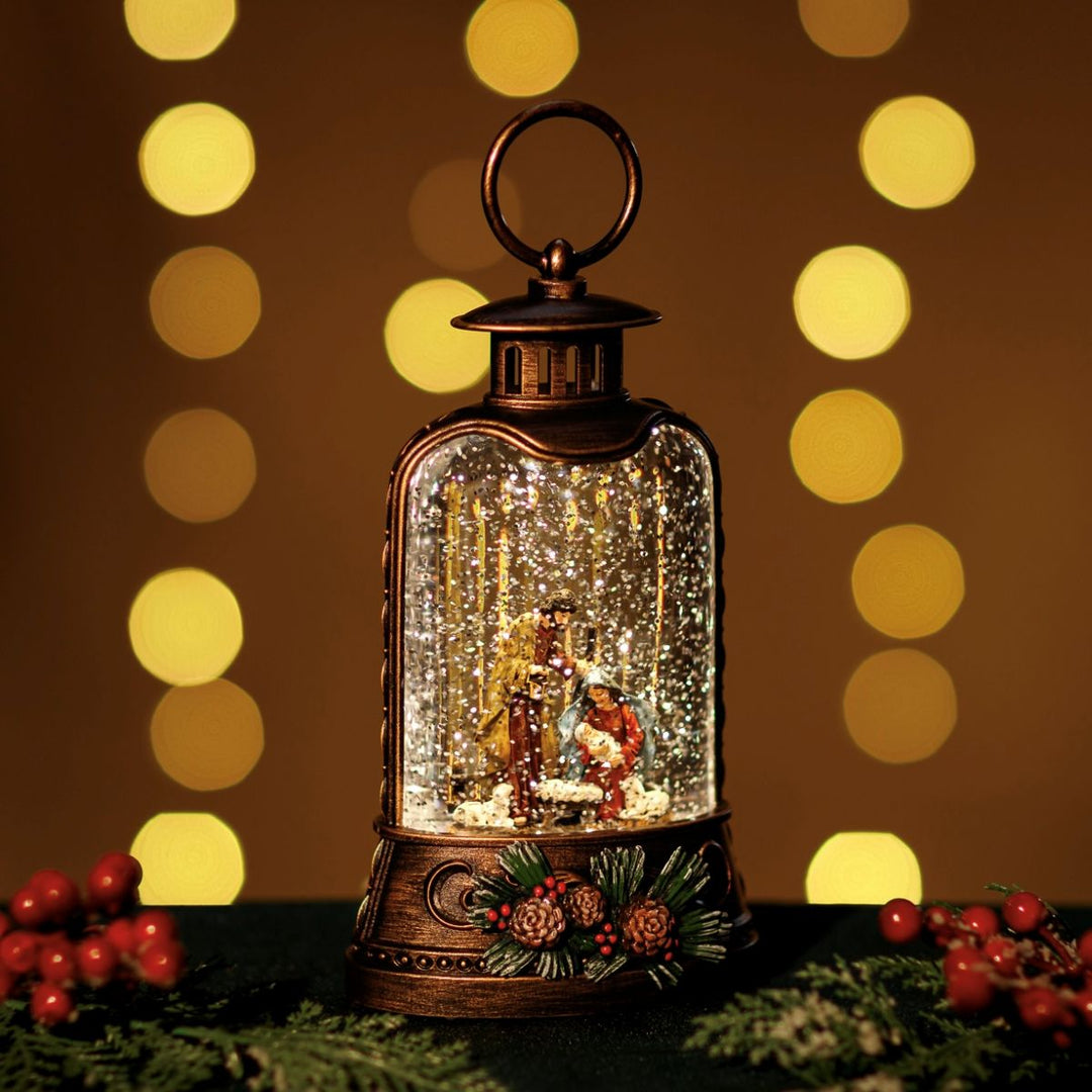 Decorative lantern with a Christmas scene inside, surrounded by festive decorations and lights.