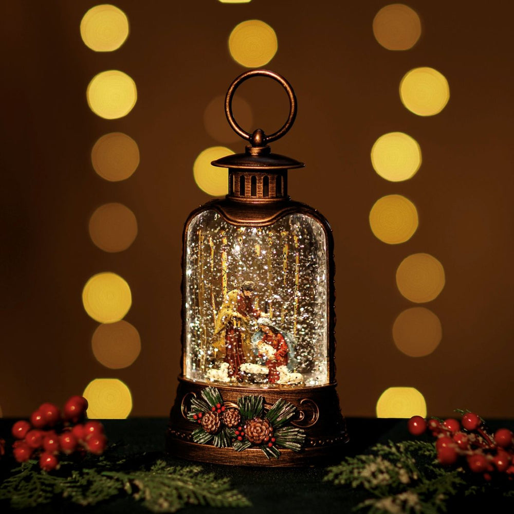 Lantern with nativity scene in snow globe 